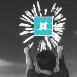 man points with both hands at fireworks with WPEngine logo overlaid on firewords